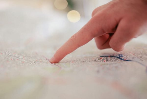 hand pointing at map